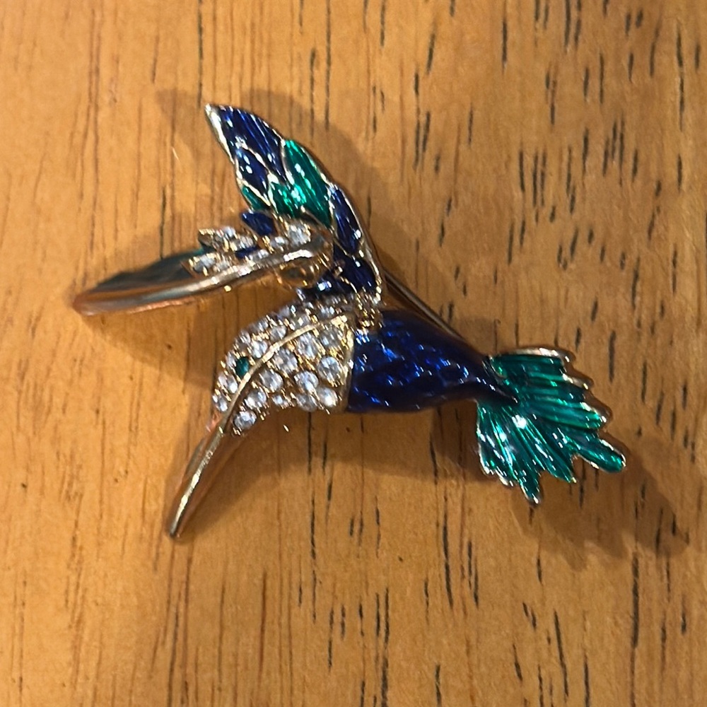 Hummingbird pin with blue and green enamel and rhinestones.